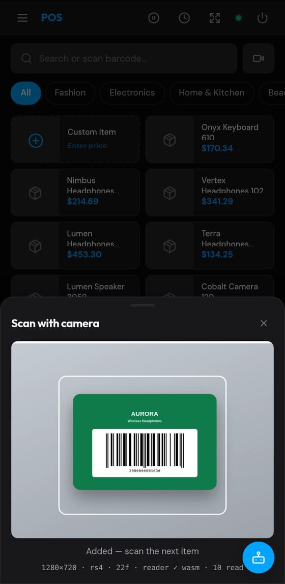 VendMizer POS on a phone — the camera scanner reading a product barcode