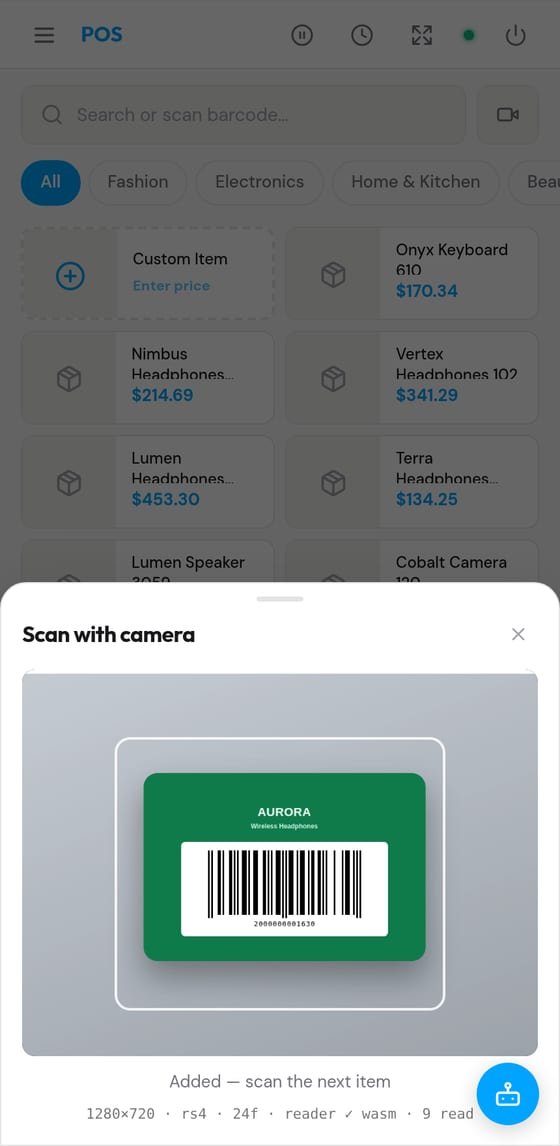 VendMizer POS on a phone — the camera scanner reading a product barcode